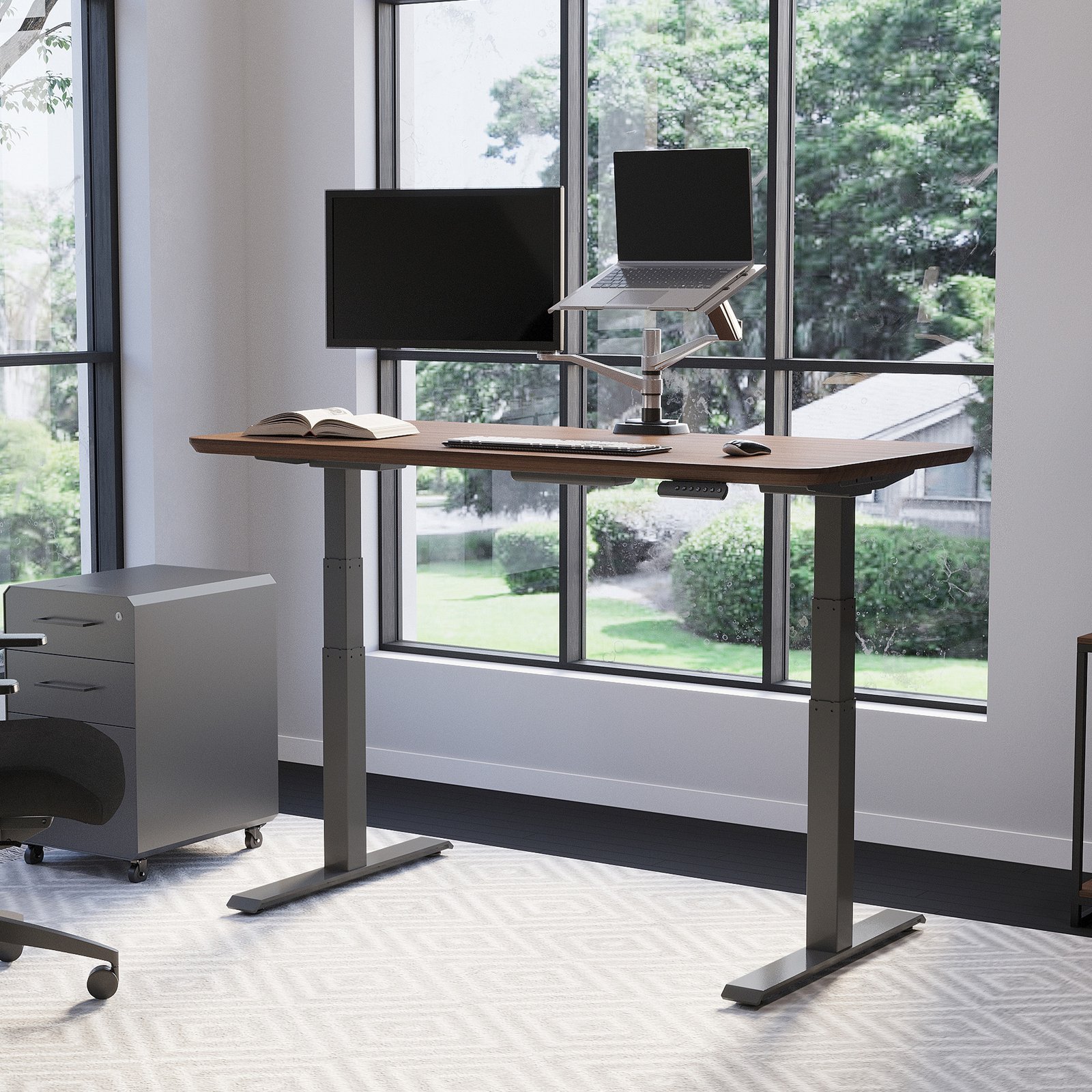 Vari Classic Electric Standing Desk 60x30 Walnut/Slate in a premium home office at standing height with dual displays