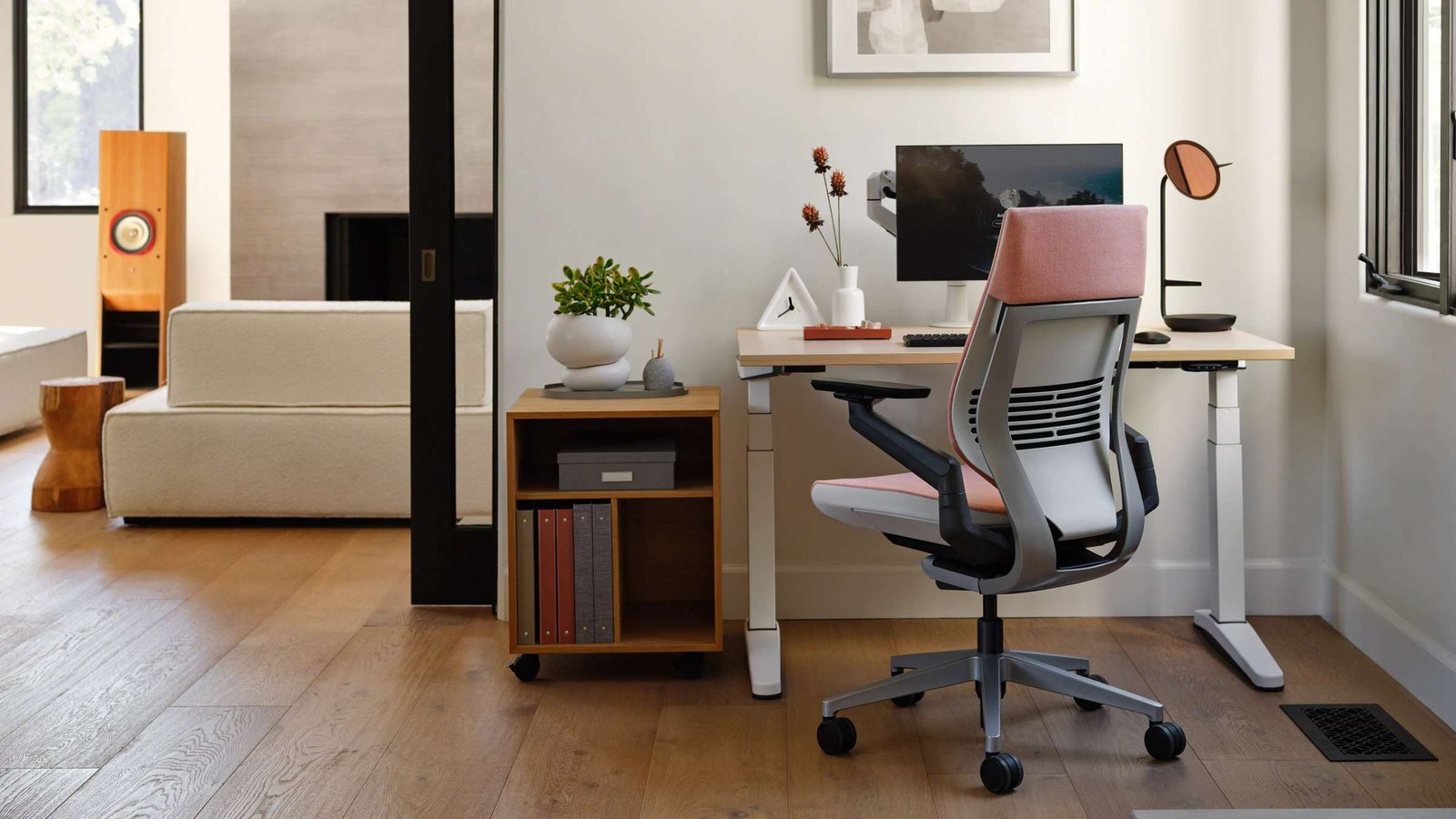 Steelcase Gesture chair in a modern home office beside a desk and computer