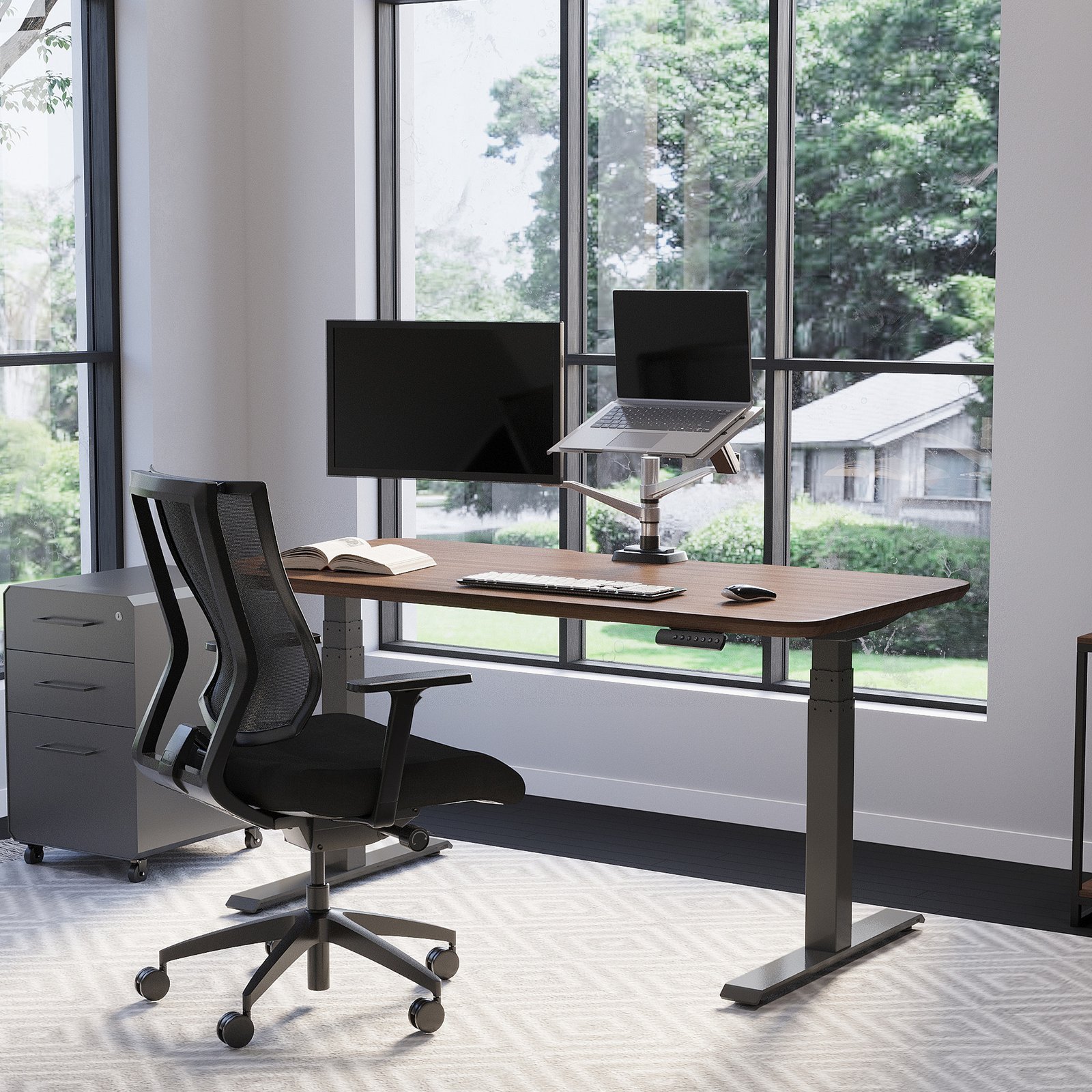 Vari Electric Standing Desk 60x30 Walnut/Slate at sitting height with a laptop and monitor workstation