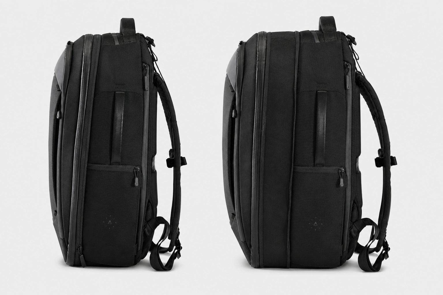 NOMATIC Navigator Travel Backpack 32L Black showing unexpanded side profile and full-perimeter expansion zipper