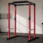 REP PR-1100 red four-post power rack in a premium home gym