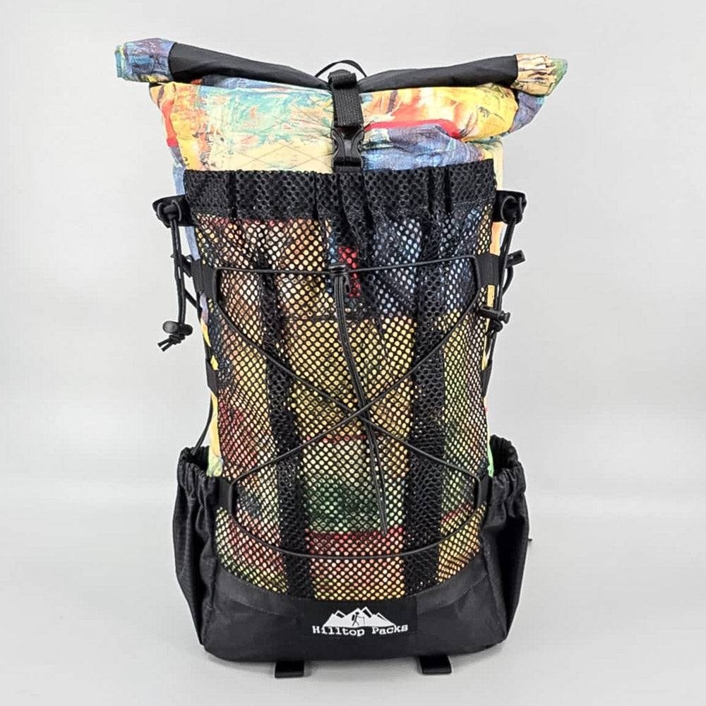 Hilltop Packs 24Seven Trail Backpack Abstract Paint 1 front mesh and shock cord