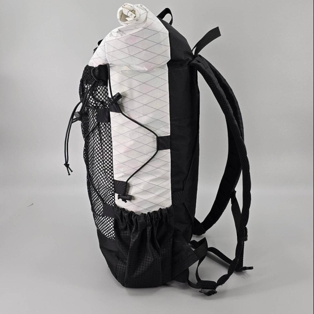 Hilltop Packs 24Seven Trail Backpack side view with stretch side pocket