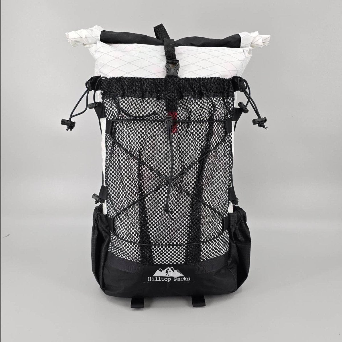 Hilltop Packs 24Seven Trail Backpack front mesh pocket and roll-top closure