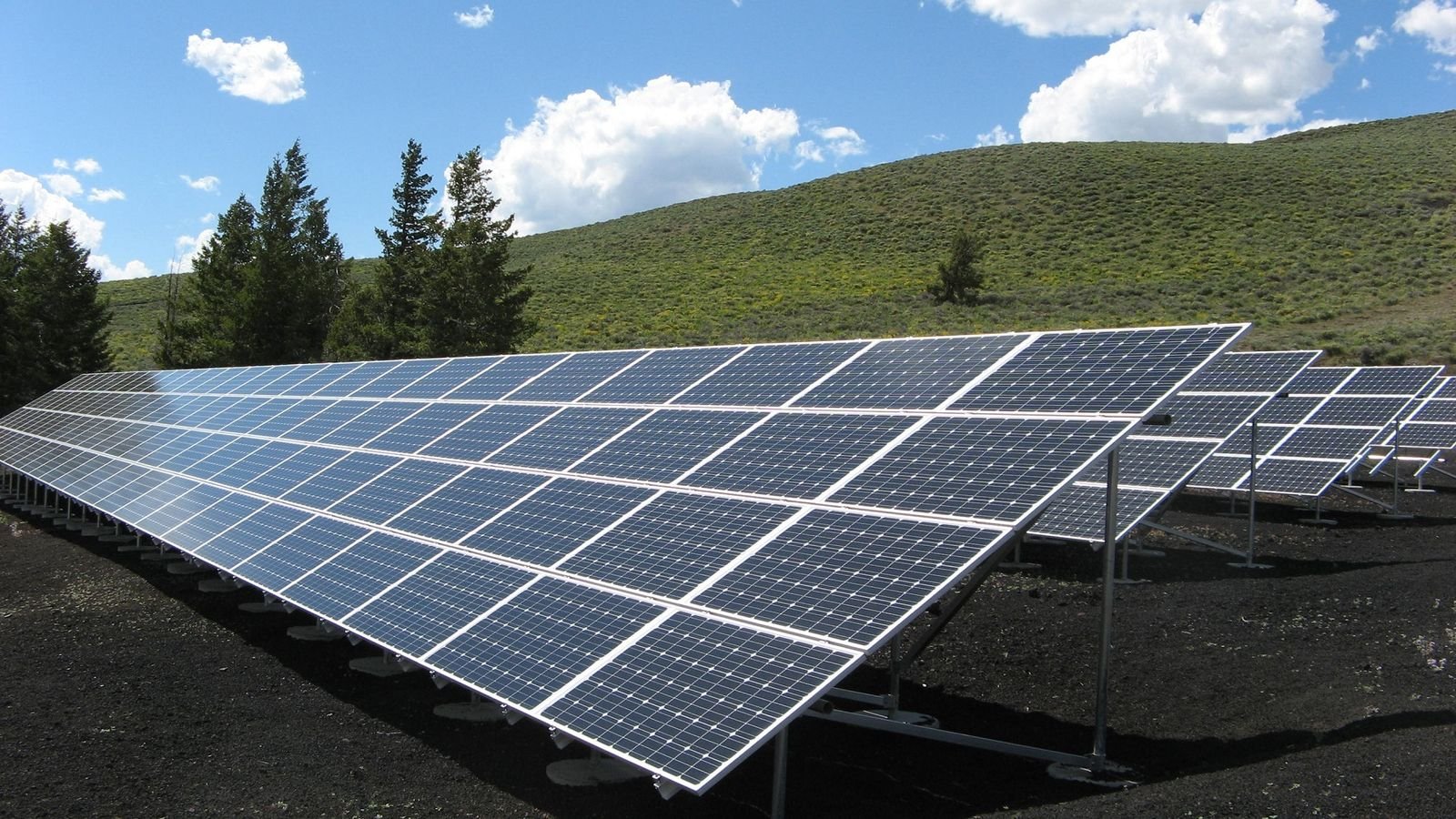Ground-mounted solar array on a hillside
