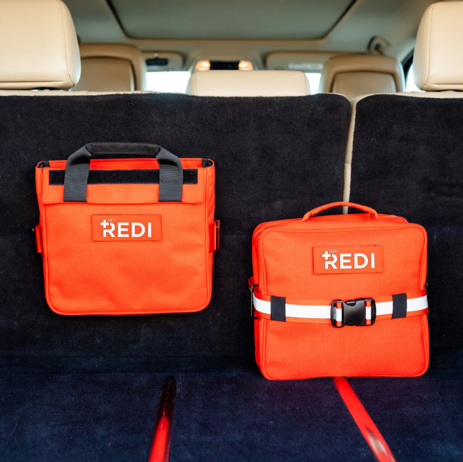 Redi Roadie+ bag and removable pack on a carpeted vehicle seat back